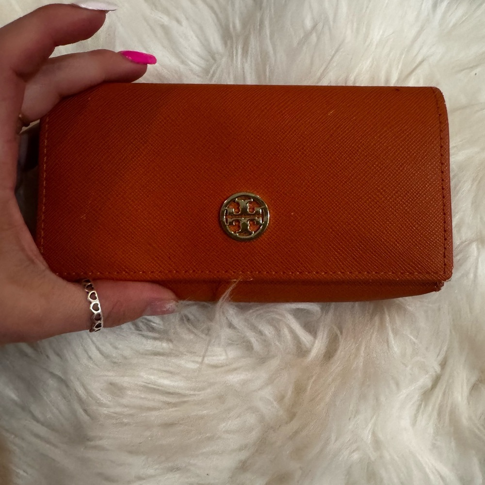 Orange Tory Burch sunglasses case